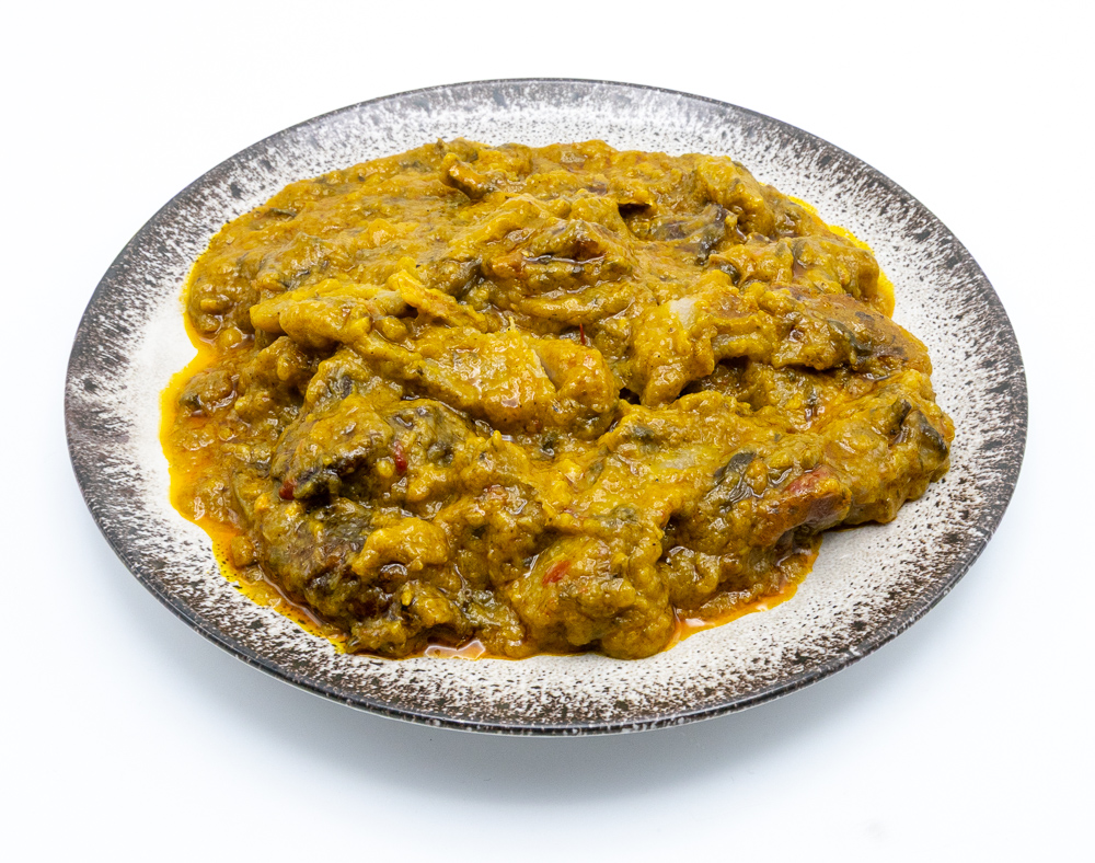 Ekwang ( Cocoyam paste folded in Taro leaves spiced with tropical country onion and Palm oil with smoked fish crumbs.(40 Ron)