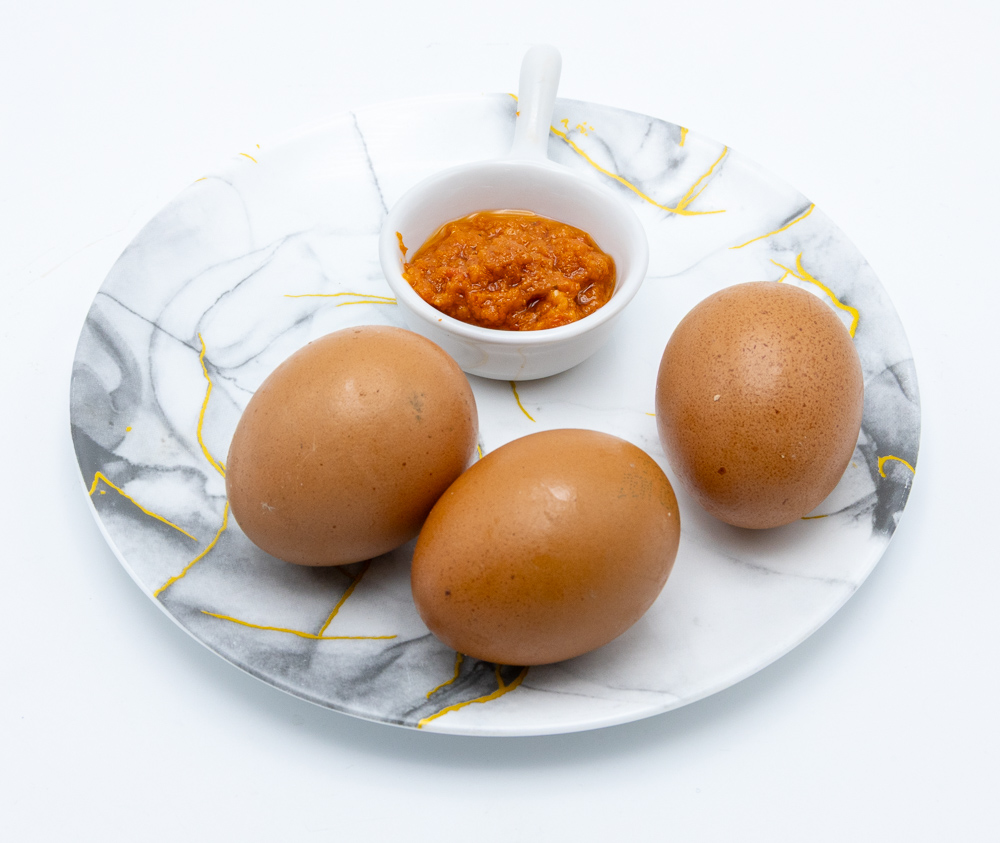 Boiled eggs with spiced sauce